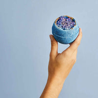 Miss Patisserie night geode bath ball. Image shows someone holding the geode bath bomb in their hand. Vegan and cruelty-free. Available at Lovethical along with plenty of other vegan and cruelty-free beauty products, makeup, make up, toiletries and cosmetics for all your gift and present needs. 