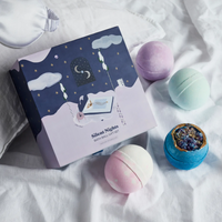 Miss Patisserie Silent Nights bath bomb gift set. Picture shows the gift set resting on bed sheets. Vegan and cruelty-free. Available at Lovethical along with plenty of other vegan and cruelty-free beauty products, makeup, make up, toiletries and cosmetics for all your gift and present needs. 