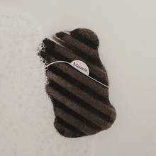 Load image into Gallery viewer, Moonie black body konjac sponge. Vegan and cruelty-free. Available at Lovethical along with plenty of other vegan and cruelty-free beauty products, makeup, make up, toiletries and cosmetics for all your gift and present needs. 
