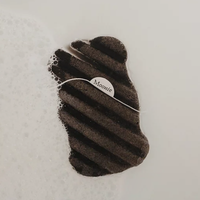 Moonie black body konjac sponge. Vegan and cruelty-free. Available at Lovethical along with plenty of other vegan and cruelty-free beauty products, makeup, make up, toiletries and cosmetics for all your gift and present needs. 