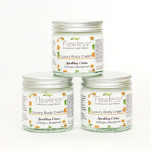 Load image into Gallery viewer, Flawless body cream - sparkling citrus. Image shows three of the products. Vegan and cruelty-free. Available at Lovethical along with plenty of other vegan and cruelty-free beauty products, makeup, make up, toiletries and cosmetics for all your gift and present needs. 
