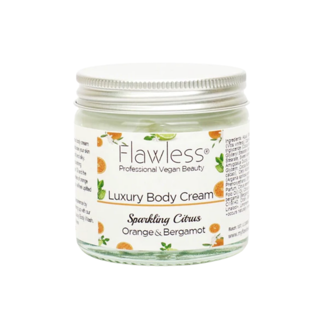 Flawless body cream - sparkling citrus. Image shows a close-up on the product in a glass pot and aluminium lid. Vegan and cruelty-free. Available at Lovethical along with plenty of other vegan and cruelty-free beauty products, makeup, make up, toiletries and cosmetics for all your gift and present needs. 