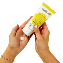 Load image into Gallery viewer, Bubble T Cosmetics lemongrass and green tea hand cream. Image shows someone&#39;s hands holding the hand cream in one hand and using it to put some hand cream in the other hand. Vegan and cruelty-free. Available at Lovethical along with plenty of other vegan and cruelty-free beauty products, makeup, make up, toiletries and cosmetics for all your gift and present needs.
