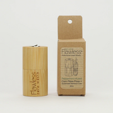 Load image into Gallery viewer, Flawless compostable dental floss with bamboo dispenser - peppermint. Image shows the bamboo dispenser and its cardboard packaging alongside it. Vegan and cruelty-free. Available at Lovethical along with plenty of other vegan and cruelty-free beauty products, makeup, make up, toiletries and cosmetics for all your gift and present needs. 
