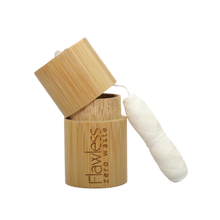 Load image into Gallery viewer, Flawless compostable dental floss with bamboo dispenser - peppermint. Image shows the bamboo dispenser and the corn fibre floss alongside it. Vegan and cruelty-free. Available at Lovethical along with plenty of other vegan and cruelty-free beauty products, makeup, make up, toiletries and cosmetics for all your gift and present needs. 

