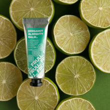 Load image into Gallery viewer, Picture of Fruu&#39;s almighty bergamot balm in front of lots of slices of bergamot. Vegan and cruelty-free. Available at Lovethical along with plenty of other vegan and cruelty-free beauty products, makeup, make up, toiletries and cosmetics for all your gift and present needs. 

