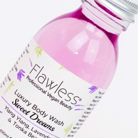 Diagonal view of 1 glass bottle of Flawless luxury body wash - Sweet Dreams - ylang ylang, lavender and tonka bean. Vegan and cruelty-free. Available at Lovethical along with plenty of other vegan and cruelty-free beauty products, makeup, make up, toiletries and cosmetics for all your gift and present needs. 