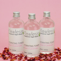 3 glass bottles of Flawless hydrating toner - rose and lavender - stood next to each other with bits of rose petals under them. Vegan and cruelty-free. Available at Lovethical along with plenty of other vegan and cruelty-free beauty products, makeup, make up, toiletries and cosmetics for all your gift and present needs. 