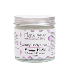 Load image into Gallery viewer, Flawless body cream - parma violet. Image shows a close-up of the product in a glass jar and aluminium lid. Vegan and cruelty-free. Available at Lovethical along with plenty of other vegan and cruelty-free beauty products, makeup, make up, toiletries and cosmetics for all your gift and present needs. 
