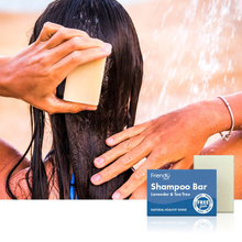 Load image into Gallery viewer, Friendly Soap lavender and tea tree shampoo bar. Image shows a woman washing her hair.
