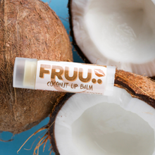 Load image into Gallery viewer, Fruu coconut lip balm. Picture shows the balm along with some coconuts. Vegan and cruelty-free. Available at Lovethical along with plenty of other vegan and cruelty-free beauty products, makeup, make up, toiletries and cosmetics for all your gift and present needs. 
