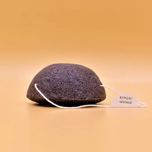 Load image into Gallery viewer, Moonie black facial konjac sponge. Vegan and cruelty-free. Available at Lovethical along with plenty of other vegan and cruelty-free beauty products, makeup, make up, toiletries and cosmetics for all your gift and present needs. 
