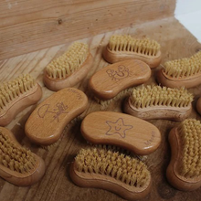 Load image into Gallery viewer, Moonie nail brush. Vegan and cruelty-free. Image shows lots of the nail brushes. Available at Lovethical along with plenty of other vegan and cruelty-free beauty products, makeup, make up, toiletries and cosmetics for all your gift and present needs. 
