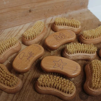 Moonie nail brush. Vegan and cruelty-free. Image shows lots of the nail brushes. Available at Lovethical along with plenty of other vegan and cruelty-free beauty products, makeup, make up, toiletries and cosmetics for all your gift and present needs. 