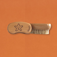 Moonie nail brush. Vegan and cruelty-free. Image shows the nail brush with the image of a smiling starfish on the top. Available at Lovethical along with plenty of other vegan and cruelty-free beauty products, makeup, make up, toiletries and cosmetics for all your gift and present needs. 