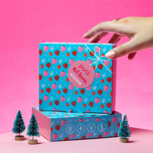 Load image into Gallery viewer, Pura Cosmetics red berries hand care gift set. Vegan and cruelty-free. Image shows two presentation gift boxes with mini Christmas trees. Available at Lovethical along with plenty of other vegan and cruelty-free beauty products, makeup, make up, toiletries and cosmetics for all your gift and present needs. 
