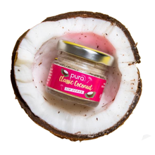 Load image into Gallery viewer, Glass pot of Pura Cosmetics classic coconut lip scrub. Image shows the lip scrub in half a coconut. Vegan and cruelty-free. Available at Lovethical along with plenty of other vegan and cruelty-free beauty products, makeup, make up, toiletries and cosmetics for all your gift and present needs. 
