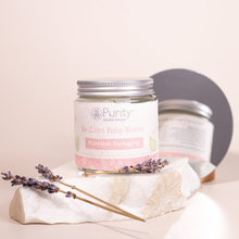 Load image into Gallery viewer, Picture of a pot of Purity&#39;s Be Calm Baby Butter on a stone slab, with some lavender placed on the stone. Vegan and cruelty-free. Available at Lovethical along with plenty of other vegan and cruelty-free beauty products, makeup, make up, toiletries and cosmetics for all your gift and present needs. 
