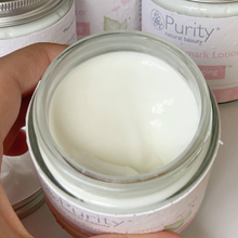 Load image into Gallery viewer, Close-up picture of an open pot of Purity&#39;s Scar and Stretchmark Lotion, showing its creamy consistency. Vegan and cruelty-free. Available at Lovethical along with plenty of other vegan and cruelty-free beauty products, makeup, make up, toiletries and cosmetics for all your gift and present needs. 

