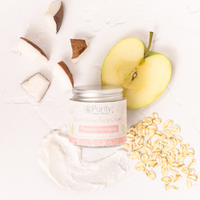 Picture taken from above of a pot of Purity's youth glow face cream alongside half an apple, some rolled oats, some coconut pieces and a sample of the face cream delicately smeared there too. Vegan and cruelty-free. Available at Lovethical along with plenty of other vegan and cruelty-free beauty products, makeup, make up, toiletries and cosmetics for all your gift and present needs. 