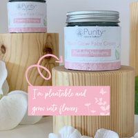 Picture of two pots of Purity's Youth Glow Face Cream on wooden stands, with a sign saying 'I'm plantable and turn into flowers'. Vegan and cruelty-free. Available at Lovethical along with plenty of other vegan and cruelty-free beauty products, makeup, make up, toiletries and cosmetics for all your gift and present needs. 