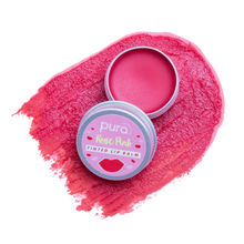 Load image into Gallery viewer, Pura Cosmetics pink tinted lip balm. Vegan and cruelty-free. Image shows the an open tin of lip balm with the vibrant pink pigment neatly smeared behind it. Available at Lovethical along with plenty of other vegan and cruelty-free beauty products, makeup, make up, toiletries and cosmetics for all your gift and present needs. 
