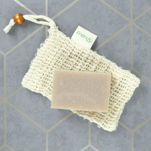 Load image into Gallery viewer, Friendly Soap soap saver - photo shows the soap saver with a bar of soap sitting on it. Vegan and cruelty-free. Available at Lovethical along with plenty of other vegan and cruelty-free beauty products, makeup, make up, toiletries and cosmetics for all your gift and present needs. 
