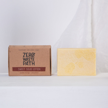 Load image into Gallery viewer, Zero Waste Path sweet solid lotion. Vegan and cruelty-free. Available at Lovethical along with plenty of other vegan and cruelty-free beauty products, makeup, make up, toiletries and cosmetics for all your gift and present needs. 
