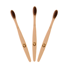 Load image into Gallery viewer, Moonie bamboo toothbrush. Vegan, cruelty-free and plastic-free. Available at Lovethical along with plenty of other vegan and cruelty-free beauty products, makeup, make up, toiletries and cosmetics for all your gift and present needs. 
