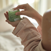 Close up picture of someone holding a tub of UpCircle body cream with one hand and scooping some out with the other. Vegan and cruelty-free. Available at Lovethical along with plenty of other vegan and cruelty-free beauty products, makeup, make up, toiletries and cosmetics for all your gift and present needs. 