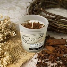Load image into Gallery viewer, UpCircle chai latte soy wax candle. Vegan and cruelty-free. Image shows the candle surrounded by its ingredients.
