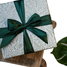Load image into Gallery viewer, Bloomtown wrapped gift set - the grove (blood orange and pink grapefruit). Vegan and cruelty-free. Image shows a beautifullly wrapped box with a green bow around it. Available at Lovethical along with plenty of other vegan and cruelty-free beauty products, makeup, make up, toiletries and cosmetics for all your gift and present needs. 
