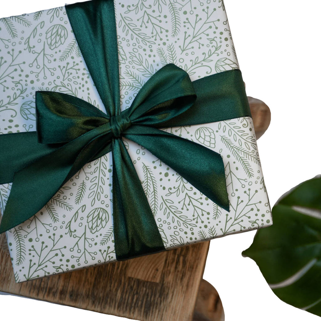 Bloomtown wrapped gift set - the rose garden (musk rose and white florals). Vegan and cruelty-free. Image shows a beautifullly wrapped box with a green bow around it. Available at Lovethical along with plenty of other vegan and cruelty-free beauty products, makeup, make up, toiletries and cosmetics for all your gift and present needs. 