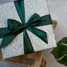 Load image into Gallery viewer, Bloomtown wrapped gift set - the grove (blood orange and pink grapefruit). Vegan and cruelty-free. Image shows a beautifullly wrapped box with a green bow around it. Available at Lovethical along with plenty of other vegan and cruelty-free beauty products, makeup, make up, toiletries and cosmetics for all your gift and present needs. 
