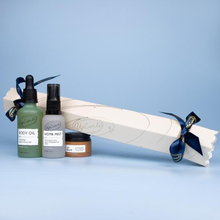 Load image into Gallery viewer, UpCircle Festive Trio Gift Set. Vegan and cruelty-free. Image shows the cracker and the 3 products alongside it.
