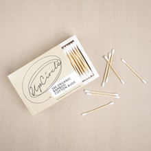 Load image into Gallery viewer, UpCircle organic cotton buds. Vegan and cruelty-free. Image shows an open packet of the cotton buds.
