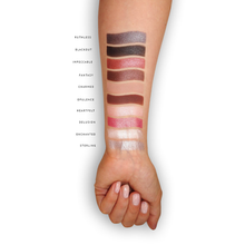 Load image into Gallery viewer, London Copyright Eyeshadow Palette - The Opera colour swatches on arm. Vegan and cruelty-free. Available at Lovethical along with plenty of other vegan and cruelty-free beauty products, makeup, make up, toiletries and cosmetics for all your gift and present needs. 
